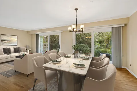 a living room with furniture and a table