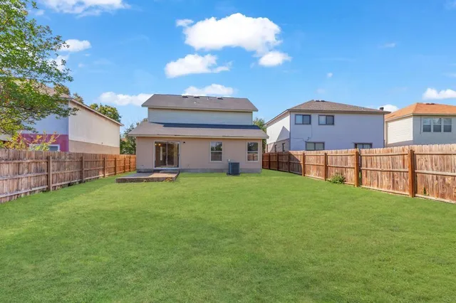 a view of a yard in front of a house with a yard