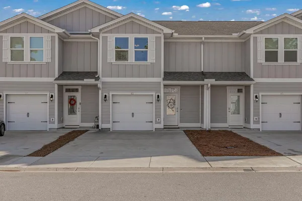 a front view of a house with a garage