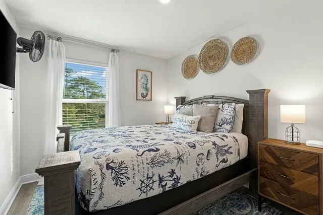 a bedroom with a bed and window