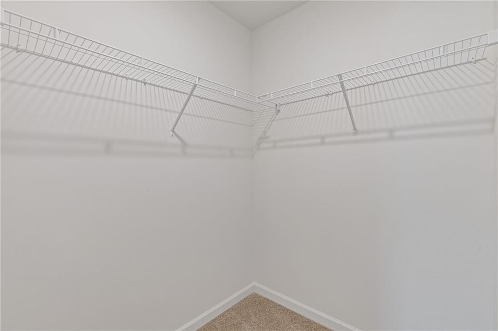 294 Ralph Still Road Dacula, GA 30019 - Photo 25 of 55 a view of a room with racks on the wall