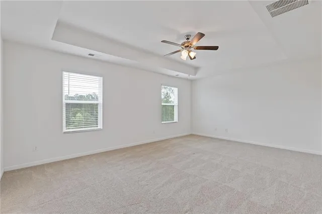 a view of empty room with windows