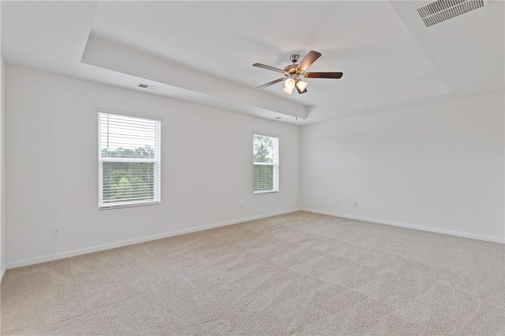 294 Ralph Still Road Dacula, GA 30019 - Photo 27 of 55 a view of empty room with windows