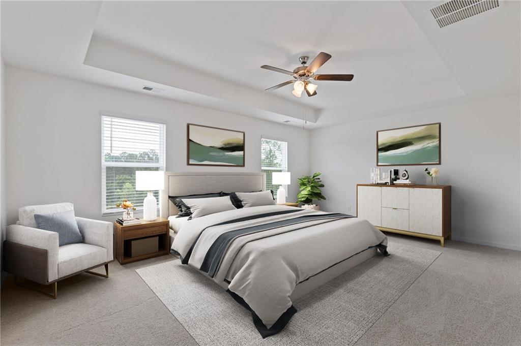 294 Ralph Still Road Dacula, GA 30019 - Photo 28 of 55 a bedroom with a bed a couch and a window