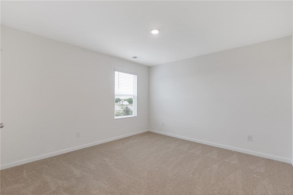 294 Ralph Still Road Dacula, GA 30019 - Photo 36 of 55 an empty room with a window