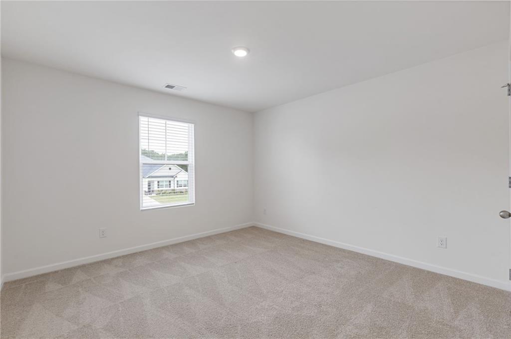 294 Ralph Still Road Dacula, GA 30019 - Photo 37 of 55 an empty room with a window
