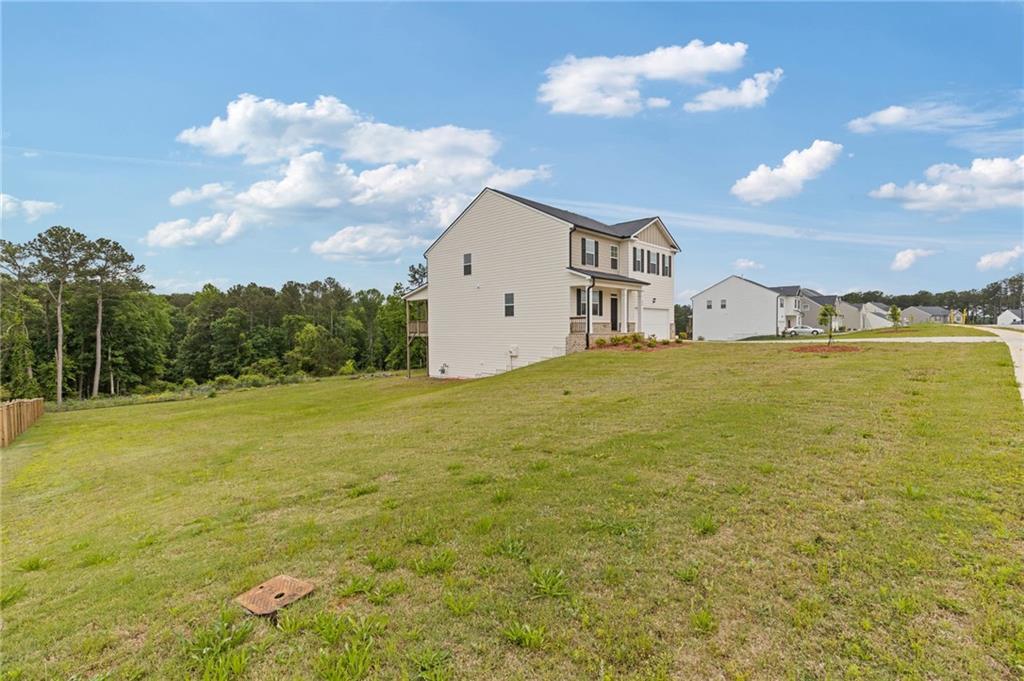 294 Ralph Still Road Dacula, GA 30019 - Photo 4 of 55 a view of a house with a yard