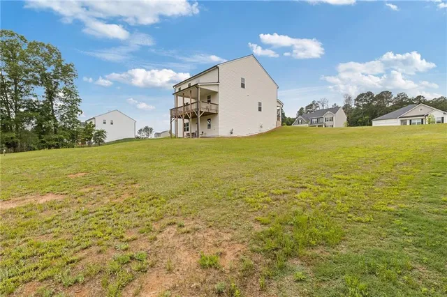 a big yard with lots of green space and plants