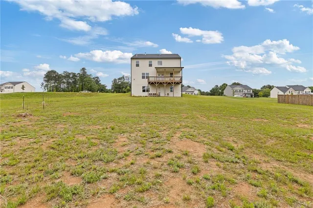 a view of a patio with table and chairs and potted plants