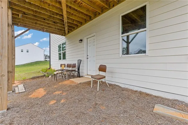 a view of a swimming pool with a yard