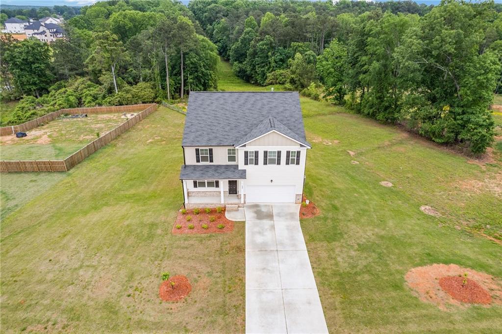 294 Ralph Still Road Dacula, GA 30019 - Photo 48 of 55 a aerial view of a house with swimming pool