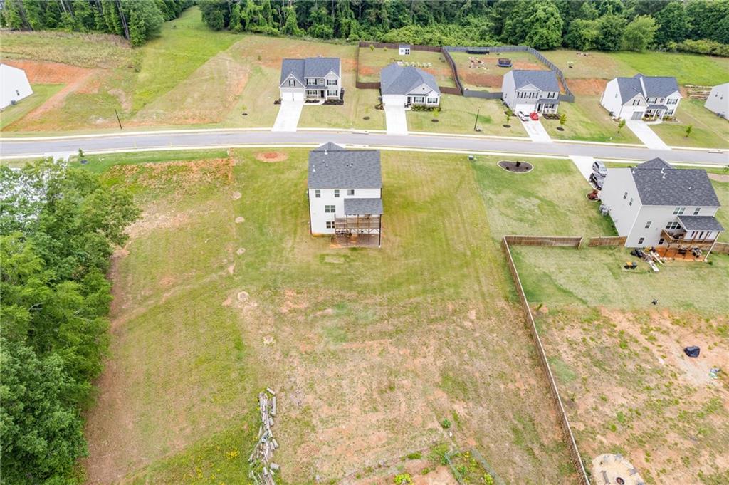 294 Ralph Still Road Dacula, GA 30019 - Photo 50 of 55 a view of a swimming pool with a yard