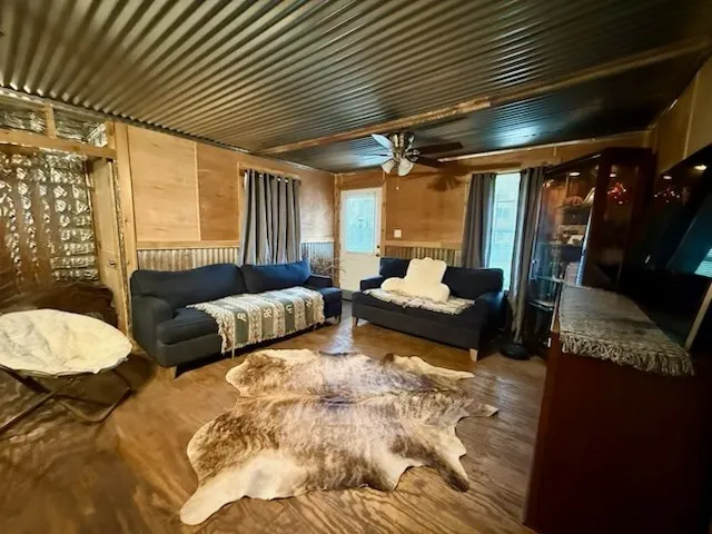 a bedroom with furniture and a large window