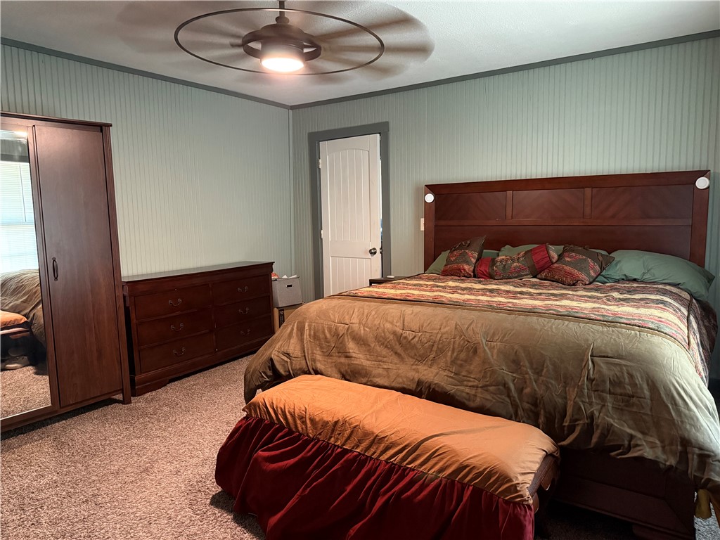 1503 North Hill Street Three Rivers, TX 78071 - Photo 7 of 17 a bedroom with a bed and dresser