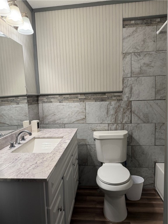 1503 North Hill Street Three Rivers, TX 78071 - Photo 9 of 17 a bathroom with a granite countertop toilet sink and mirror
