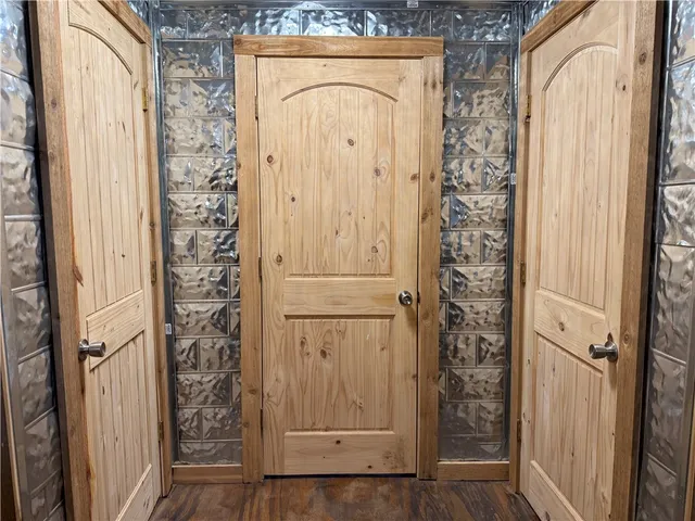 an entryway with wooden door