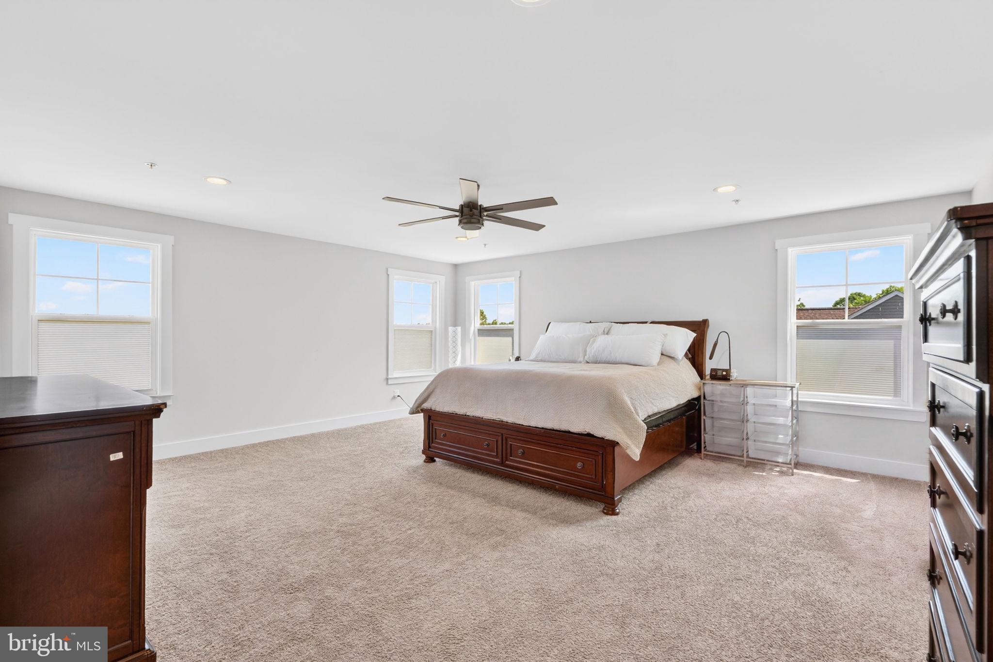 30 Range Road North East, MD 21901 - Photo 36 of 73 a spacious bedroom with a bed and a cabinets