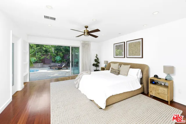 a bathroom with a sink a mirror and a shower