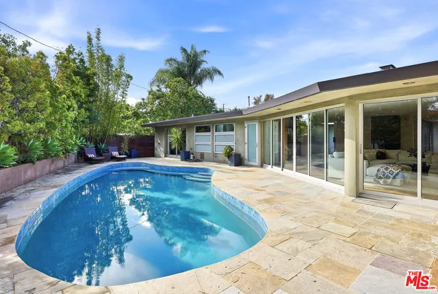 a view of a house with swimming pool