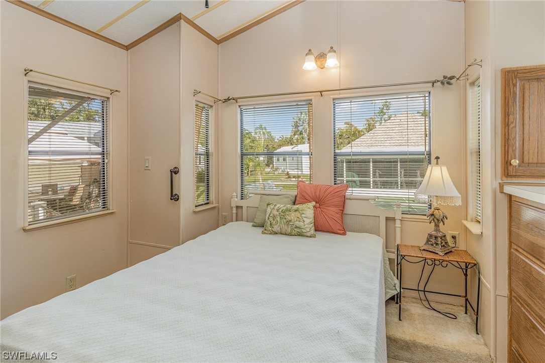 10844 Ani Circle Estero, FL 33928 - Photo 12 of 24 a bedroom with a bed and wooden floor