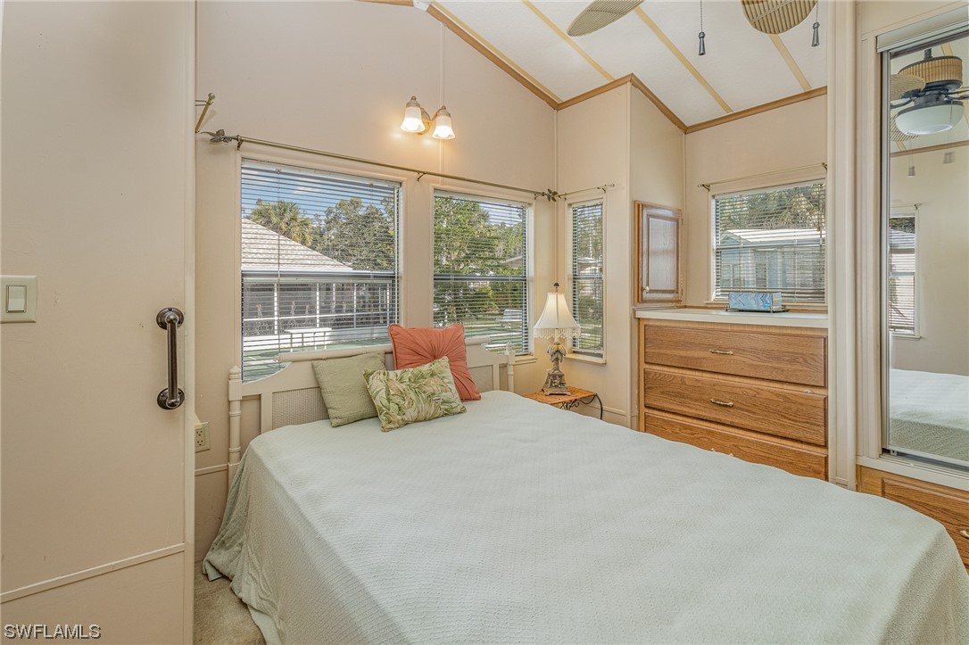 10844 Ani Circle Estero, FL 33928 - Photo 13 of 24 a bedroom with a bed and a large window