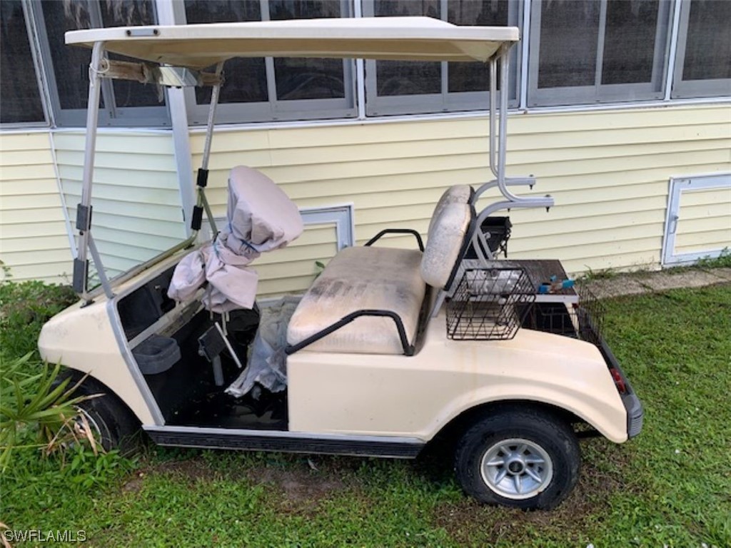 10844 Ani Circle Estero, FL 33928 - Photo 18 of 24 a view of a house with backyard and porch
