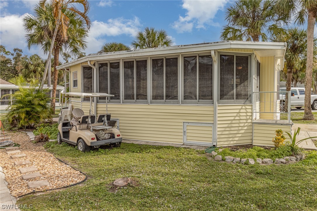 10844 Ani Circle Estero, FL 33928 - Photo 19 of 24 a front view of a house with garden