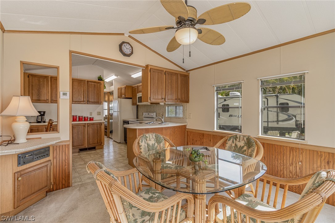 10844 Ani Circle Estero, FL 33928 - Photo 2 of 24 a living room with furniture and kitchen view