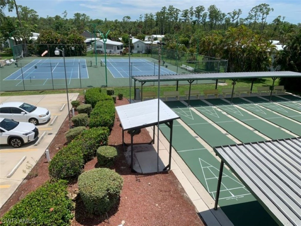 10844 Ani Circle Estero, FL 33928 - Photo 22 of 24 a view of a tennis court with furniture