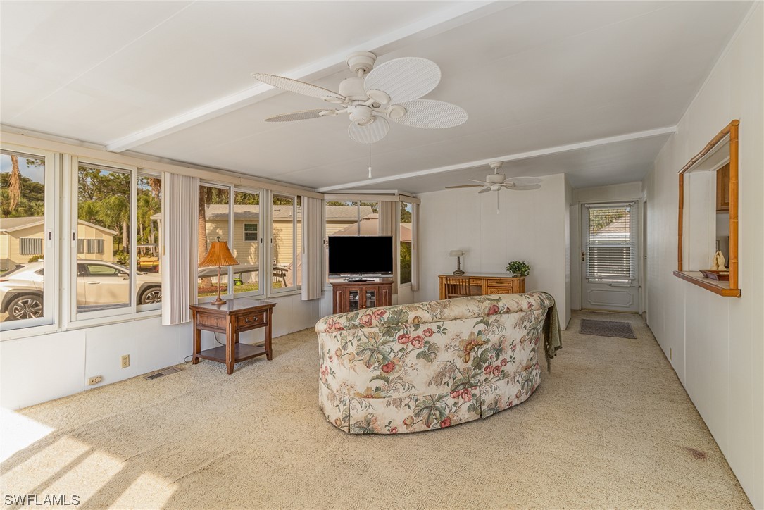 10844 Ani Circle Estero, FL 33928 - Photo 9 of 24 a living room with furniture and a flat screen tv