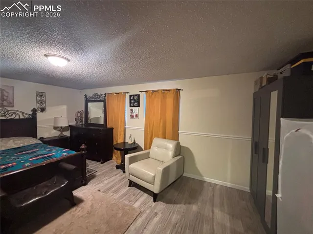 a view of house with outdoor space and car parked