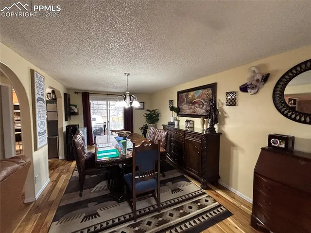 a bed room with a bed window and a television