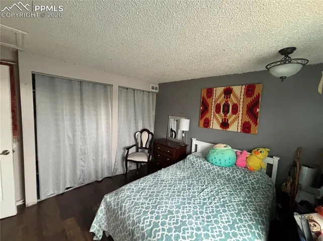 a bedroom with furniture and a fireplace