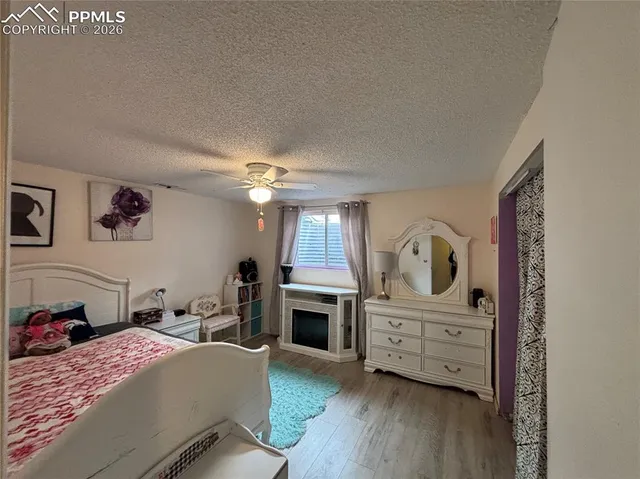 a kitchen with a refrigerator a stove a sink dishwasher with a dining table and chairs