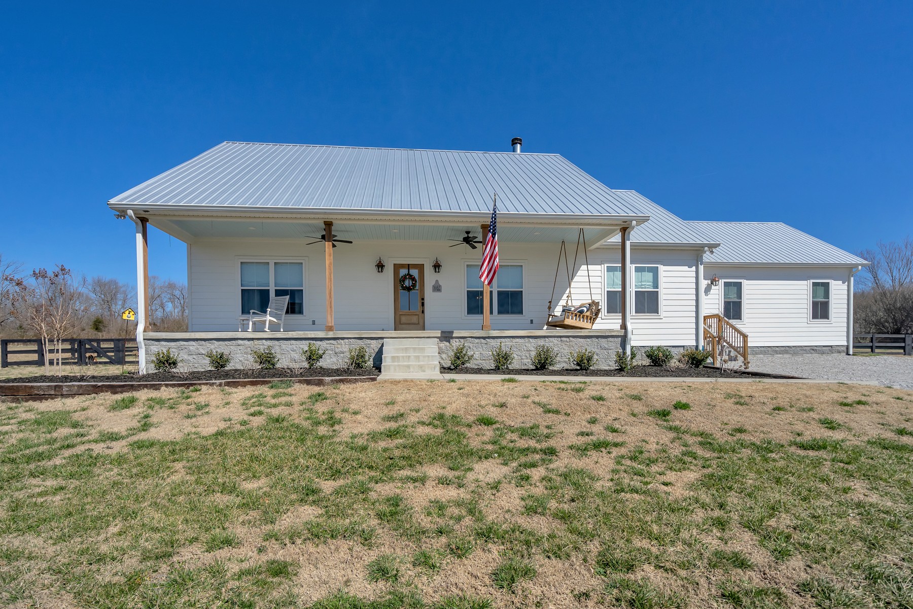 1687 Porter Road Burns, TN 37029 - Photo 1 of 32 a front view of a house with a yard