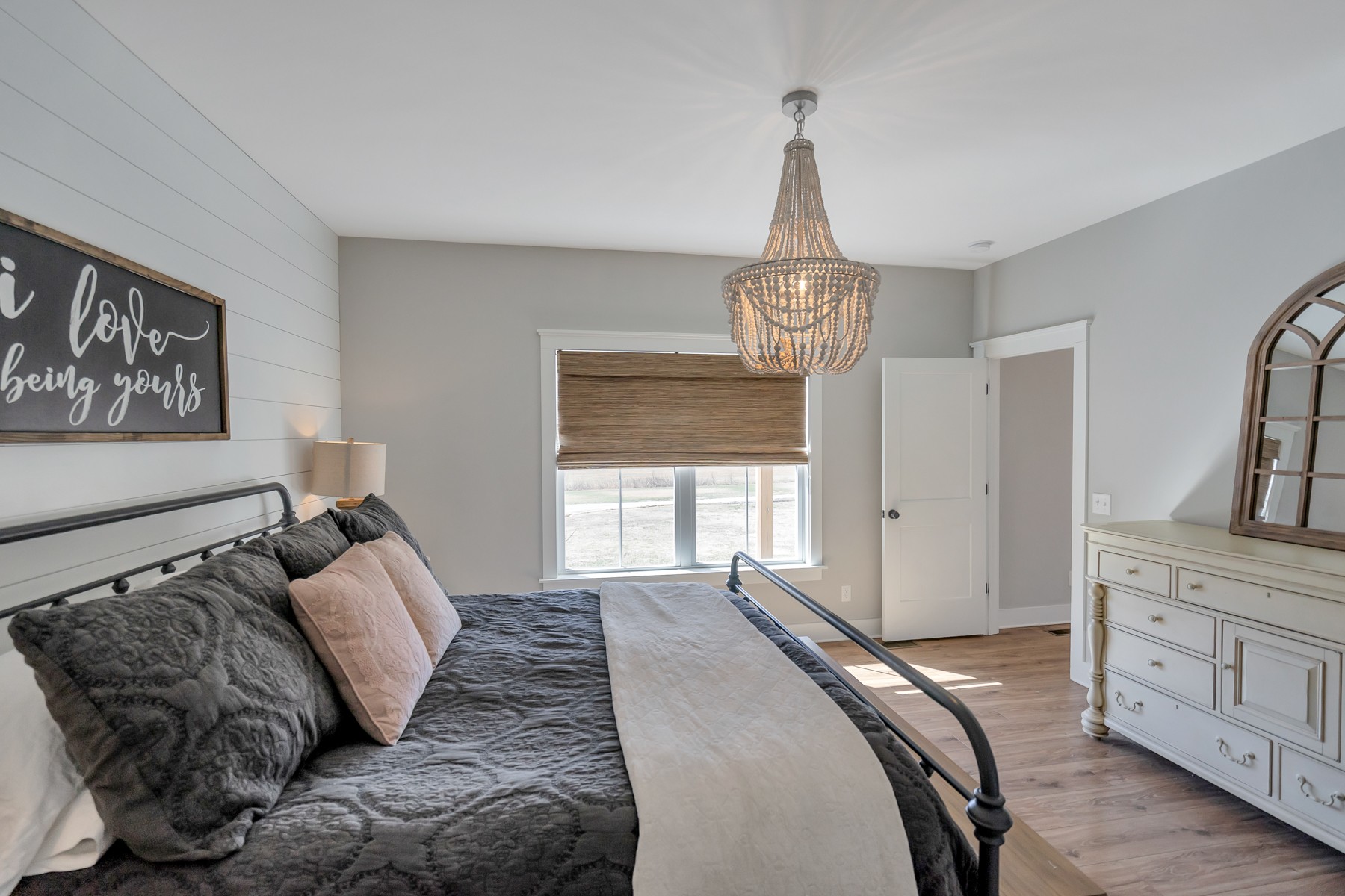1687 Porter Road Burns, TN 37029 - Photo 12 of 32 a bedroom with a bed and a chandelier