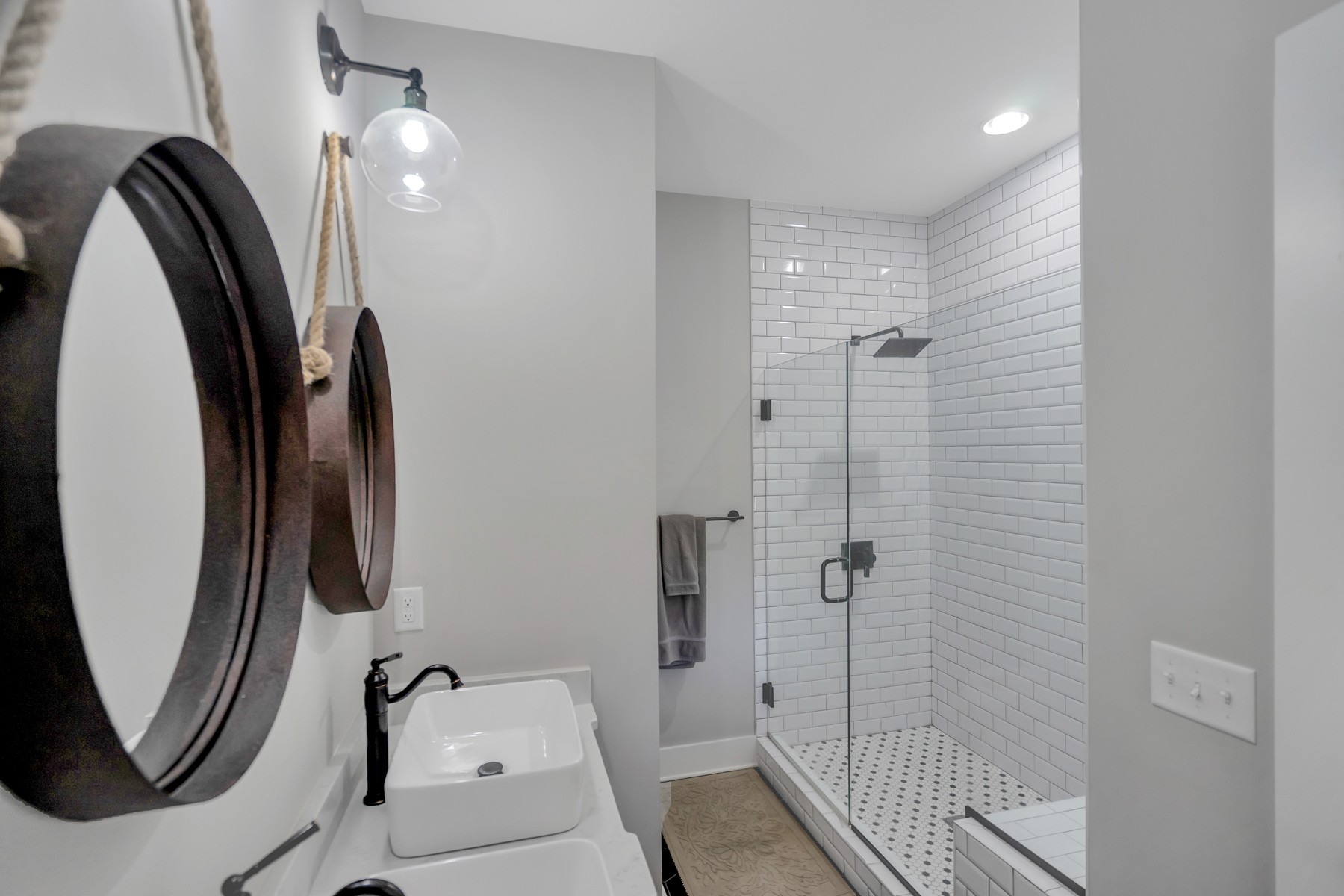 1687 Porter Road Burns, TN 37029 - Photo 14 of 32 a bathroom with a mirror and a shower