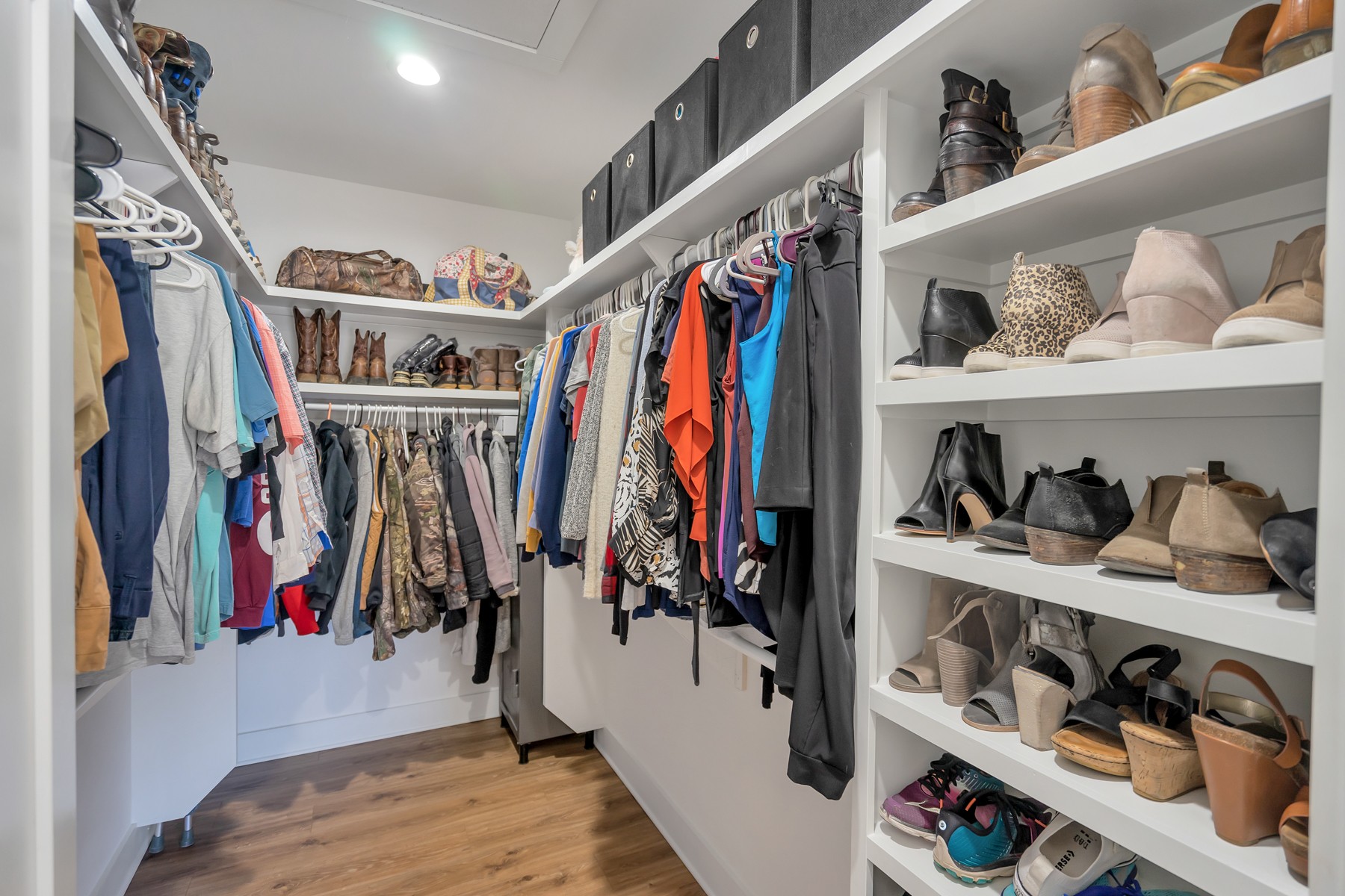1687 Porter Road Burns, TN 37029 - Photo 15 of 32 a view of walk in closet with clothes and shoes