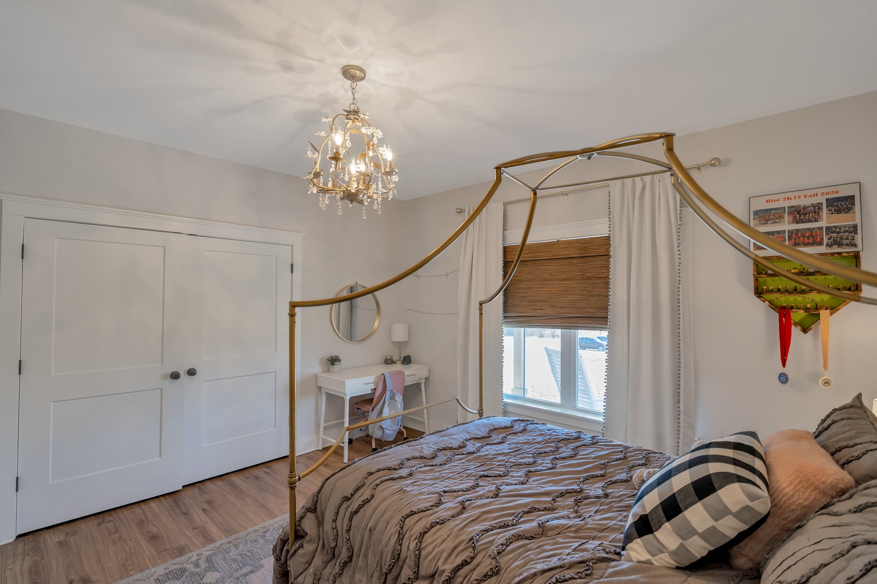1687 Porter Road Burns, TN 37029 - Photo 19 of 32 a bedroom with a bed and a chandelier