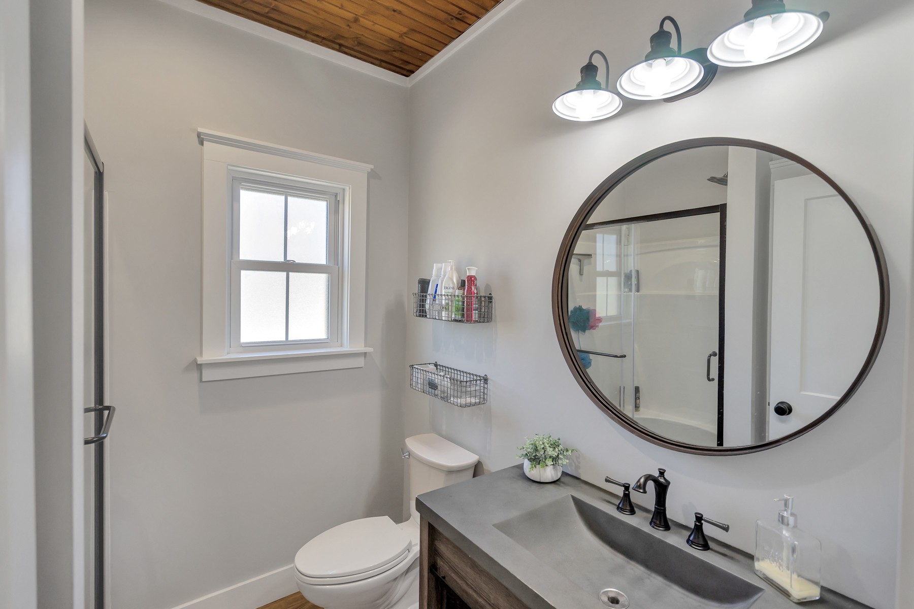 1687 Porter Road Burns, TN 37029 - Photo 23 of 32 a bathroom with a sink a mirror and a toilet