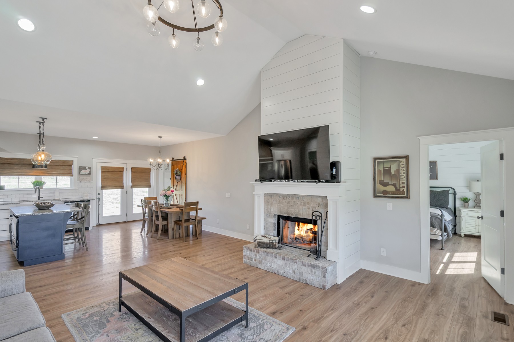 1687 Porter Road Burns, TN 37029 - Photo 5 of 32 a living room with furniture a fireplace and a flat screen tv