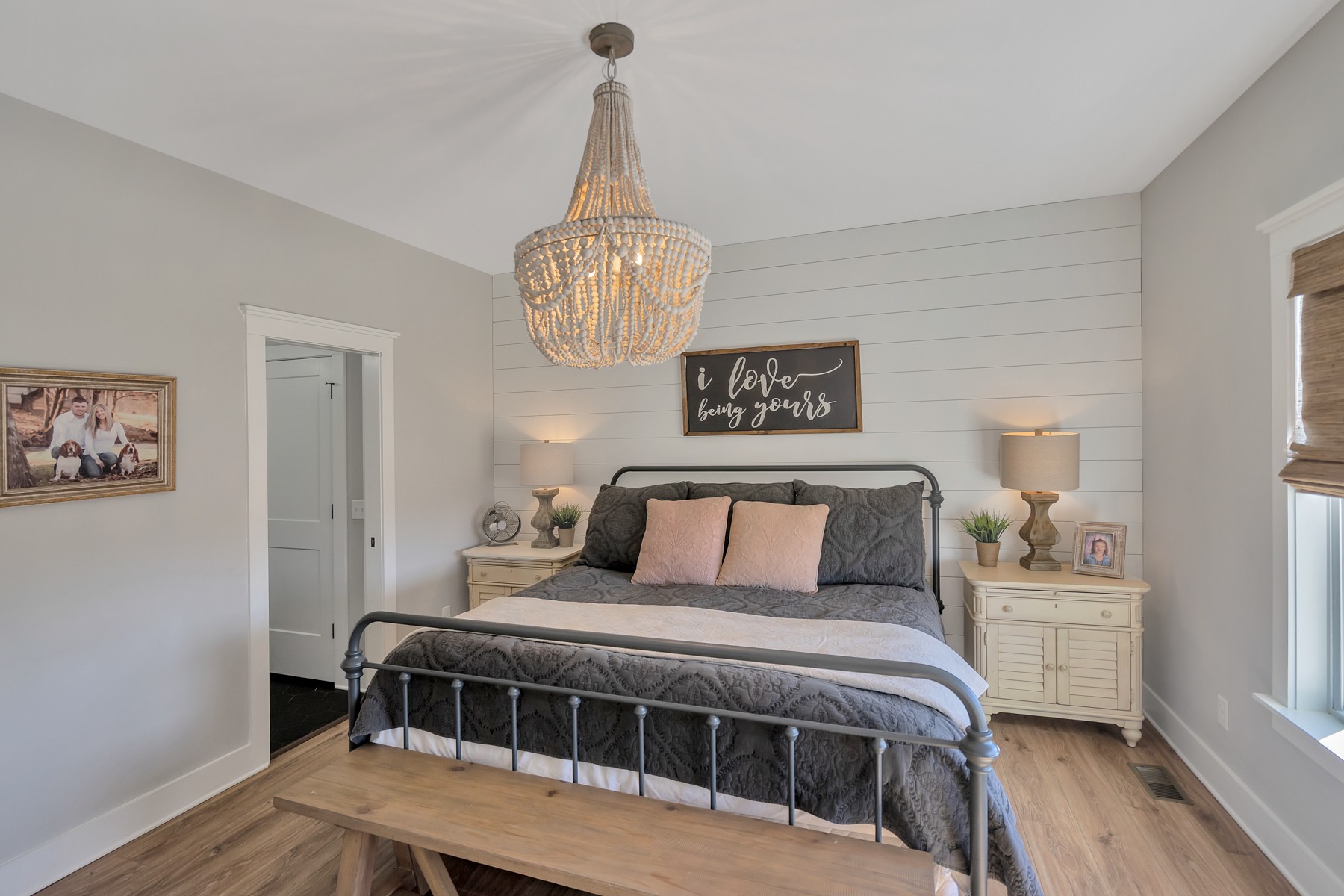 1687 Porter Road Burns, TN 37029 - Photo 10 of 32 a bedroom with a bed and a chandelier