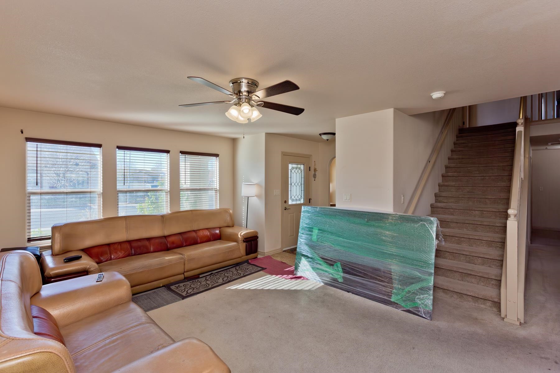 236 Frontier Street Grand Junction, CO 81503 - Photo 12 of 40 a living room with furniture and a large window