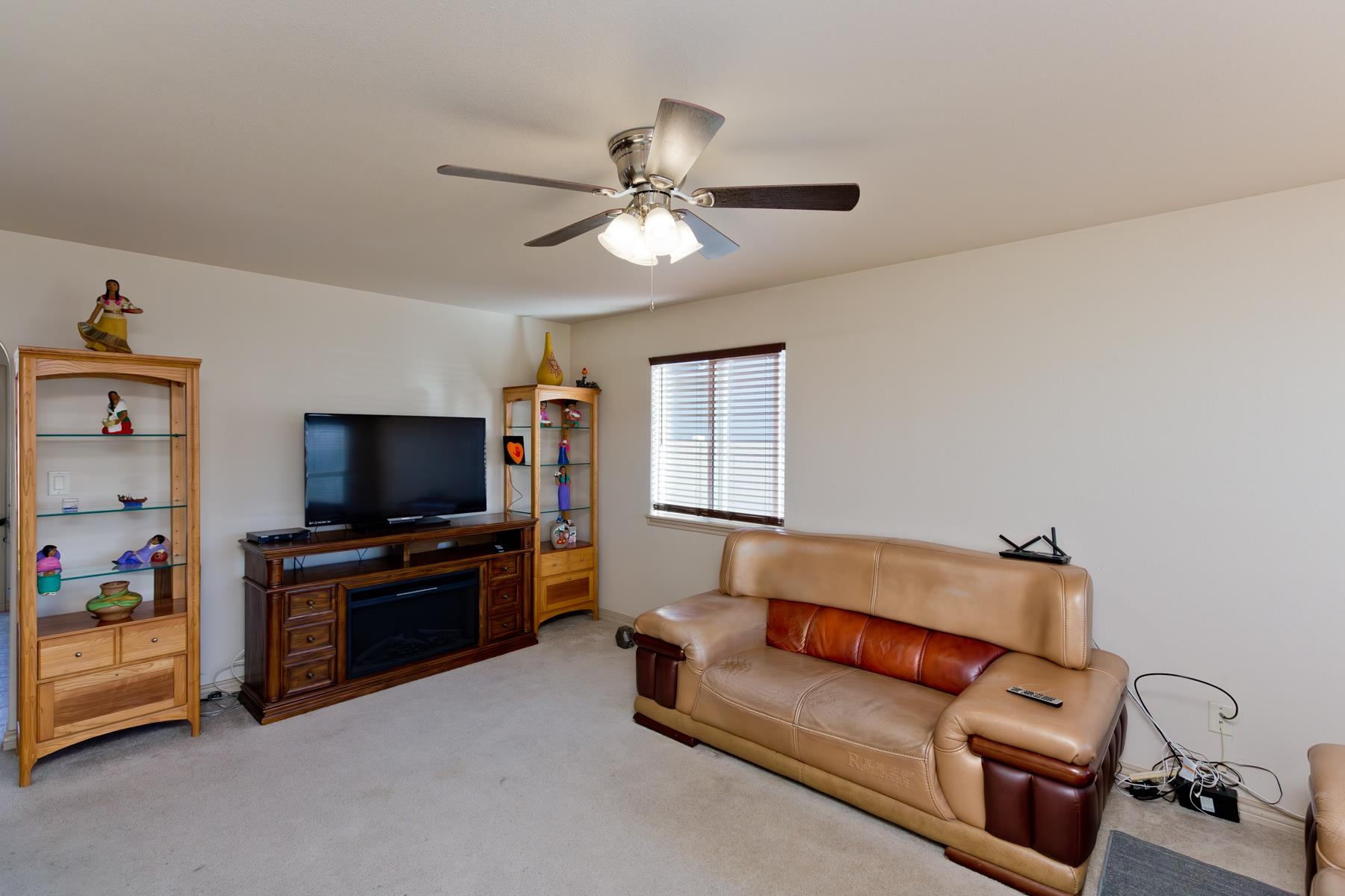 236 Frontier Street Grand Junction, CO 81503 - Photo 14 of 40 a living room with furniture and a flat screen tv