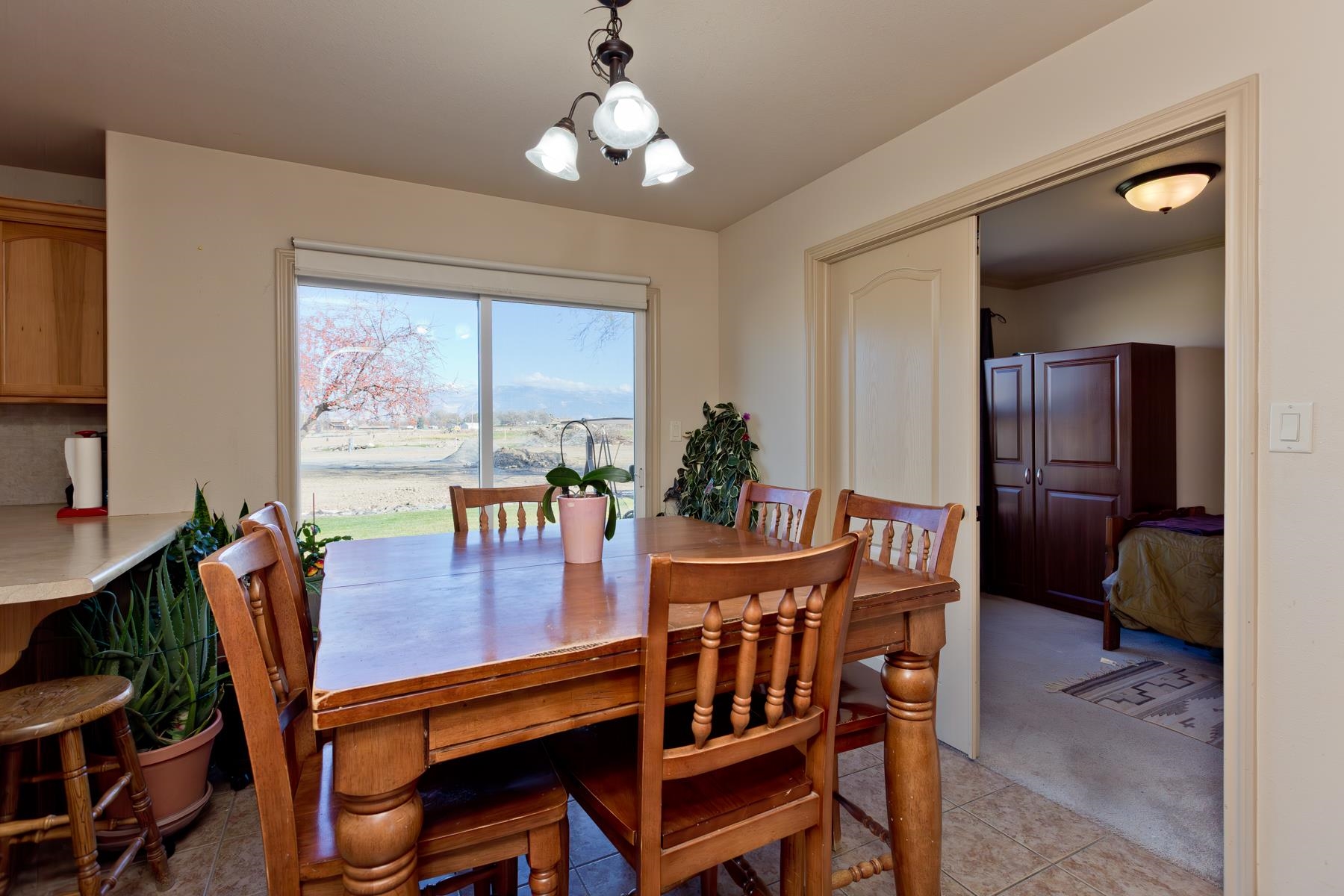 236 Frontier Street Grand Junction, CO 81503 - Photo 18 of 40 a dining room with furniture a window and a chandelier