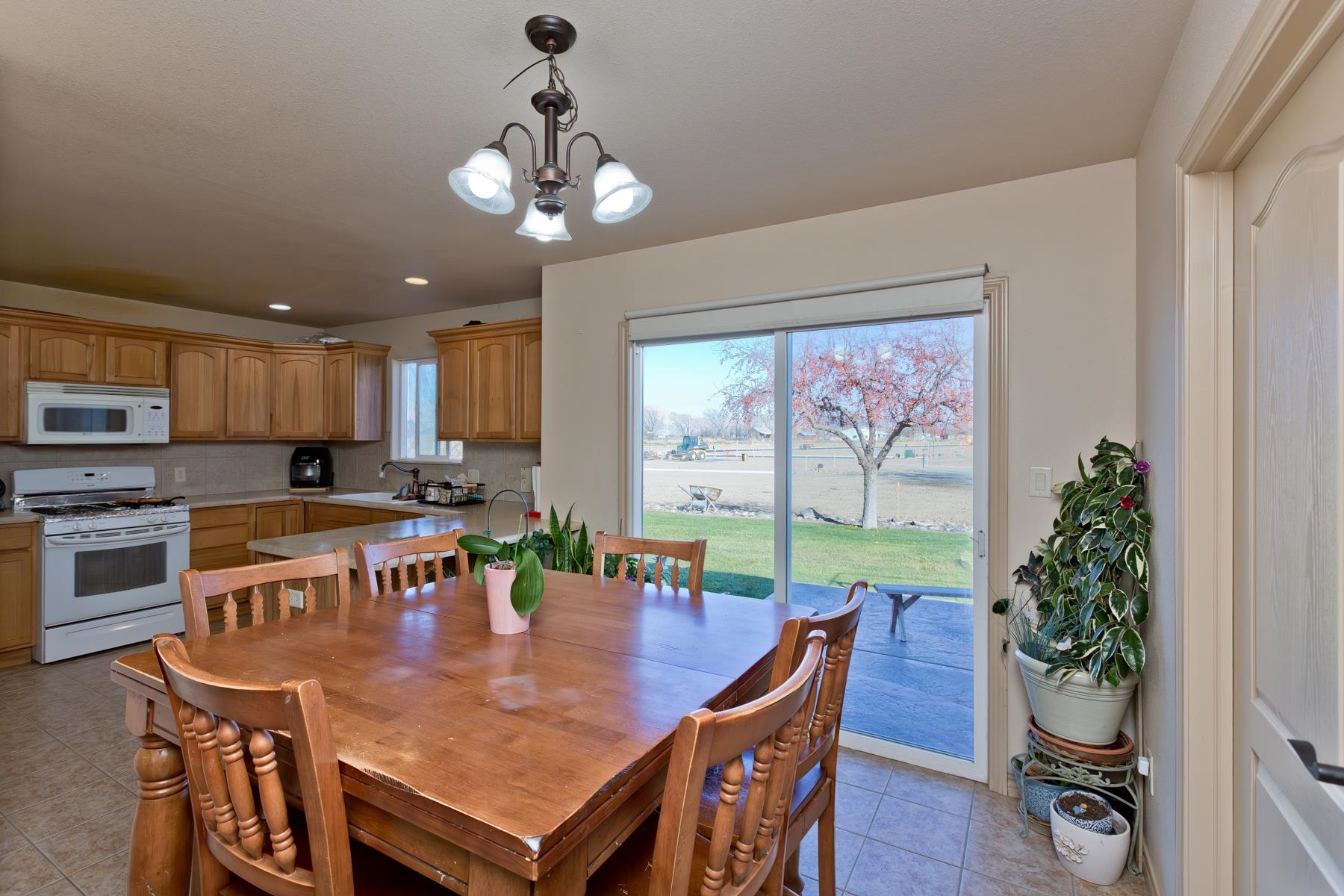 236 Frontier Street Grand Junction, CO 81503 - Photo 19 of 40 a view of a dining room with furniture window and wooden floor