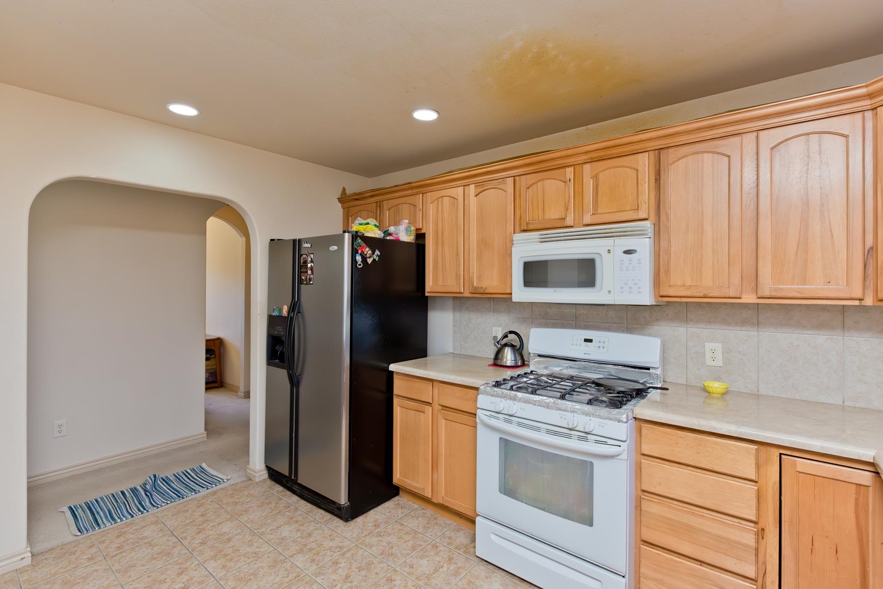 236 Frontier Street Grand Junction, CO 81503 - Photo 24 of 40 a kitchen with stainless steel appliances granite countertop a refrigerator stove and sink