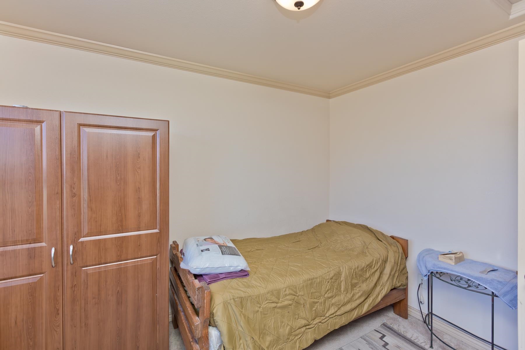 236 Frontier Street Grand Junction, CO 81503 - Photo 25 of 40 a bedroom with a bed and storage