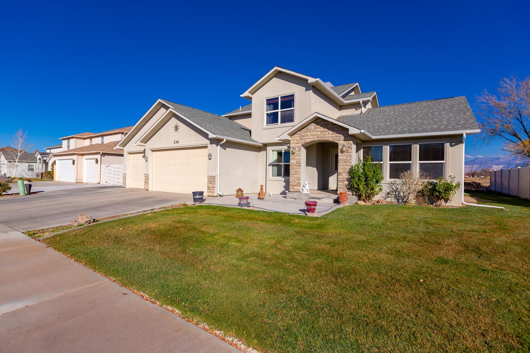 236 Frontier Street Grand Junction, CO 81503 - Photo 4 of 40 a front view of a house with a garden and porch