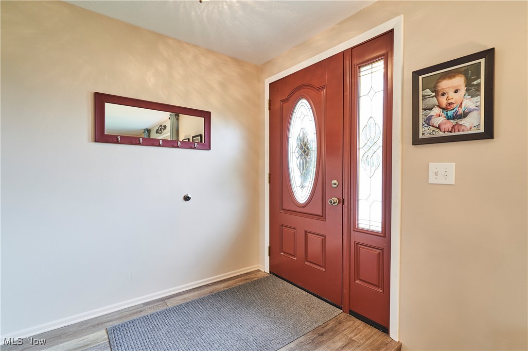 6214 Renninger Road Akron, OH 44319 - Photo 2 of 27 Entrance foyer featuring LVT flooring and double closet